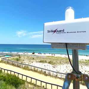 StrikeGaurd Lightning Warning System overlooking a beach.