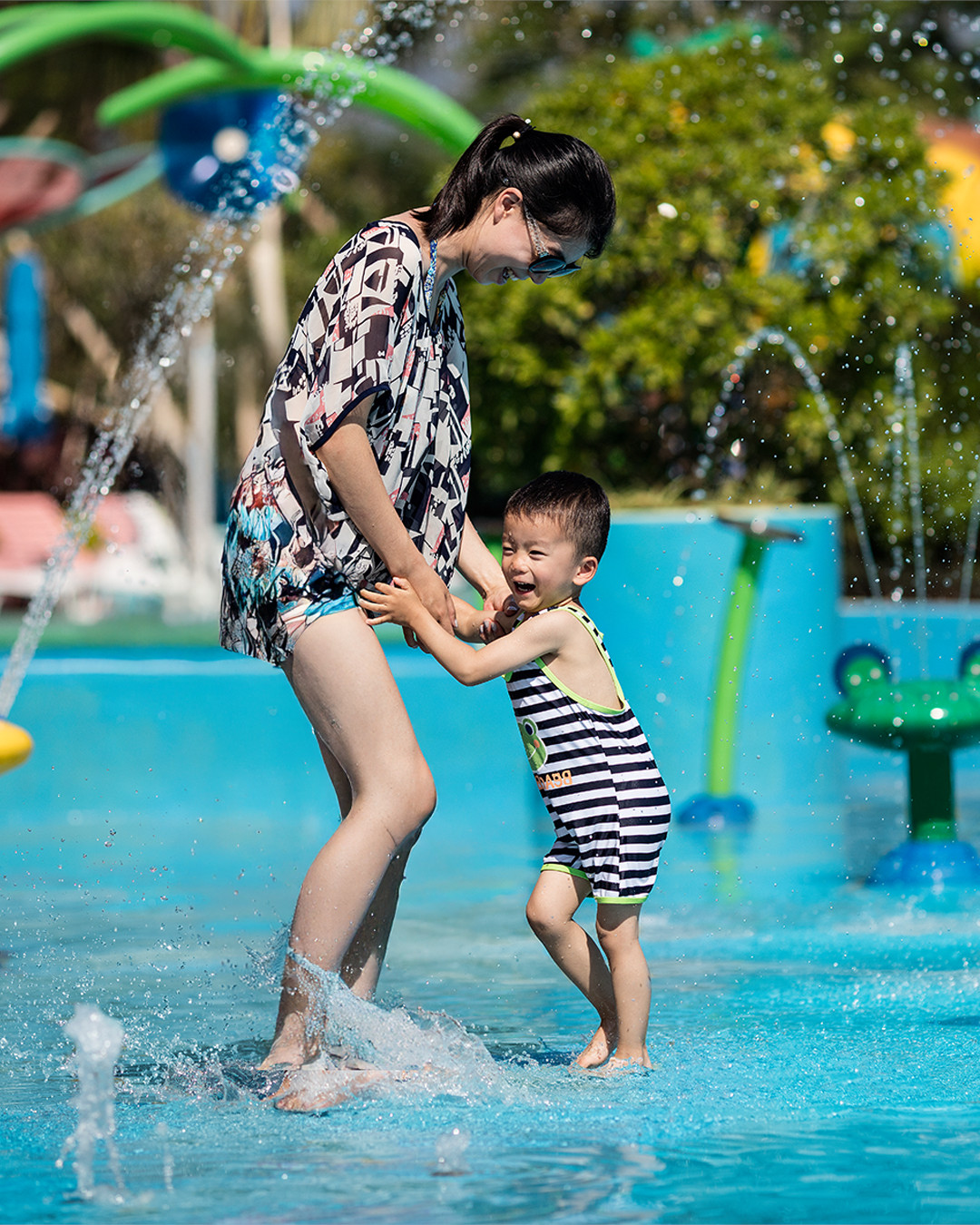 People playing in a splashpad